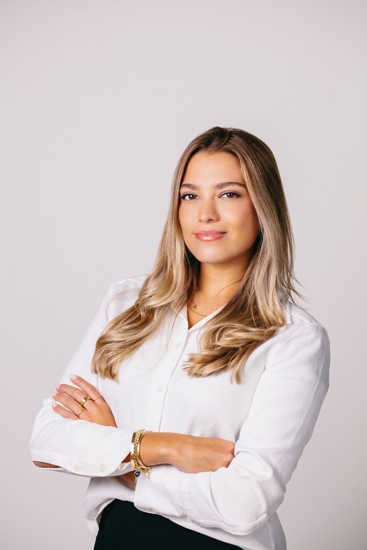 Portrait of Arantxa Lituma in a white shirt with arms crossed